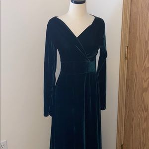 Emerald green crushed velvet dress .